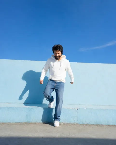 Joyful Leap in Afternoon Sun